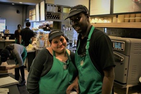 Two baristas posing for a picture
